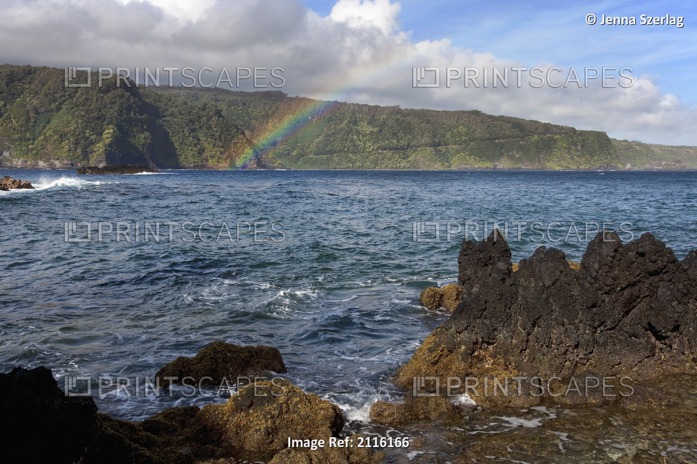 Hawaii, Maui, A rainbow forms over the road to Hana in Keanae.