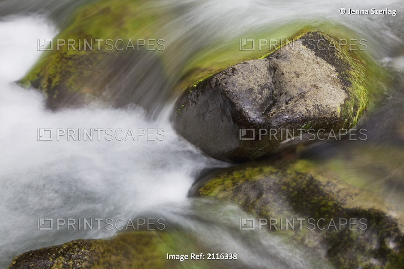 Hawaii, Maui, Iao Valley, A close up of colorful river rocks under water.