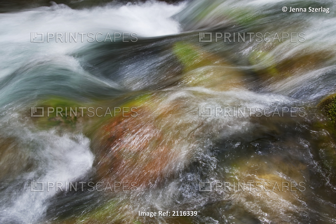 Hawaii, Maui, Iao Valley, A close up of colorful river rocks under water.