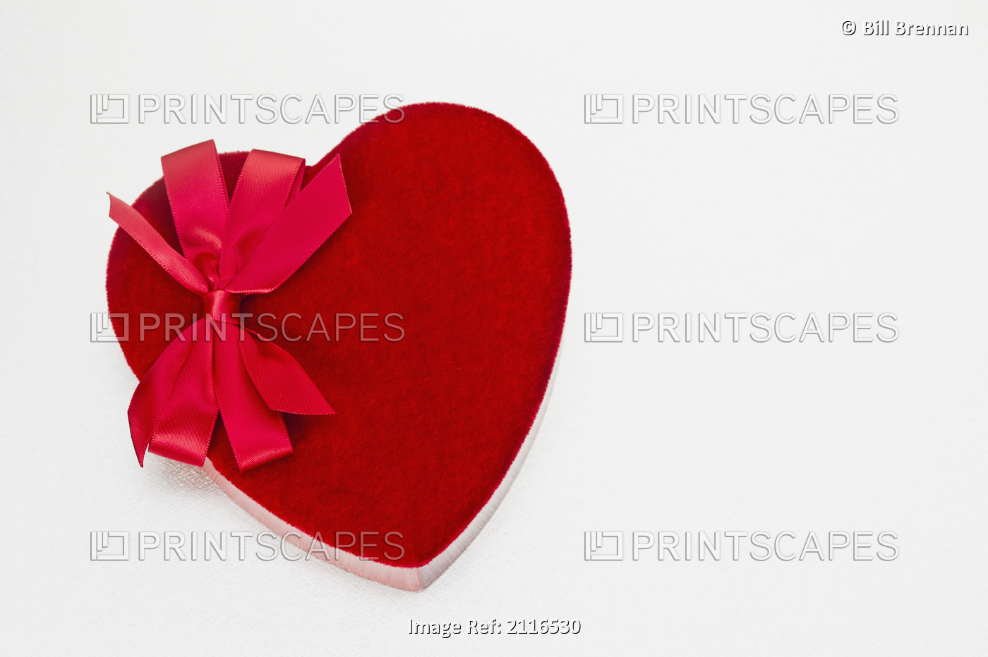 Valentines heart-shaped candy box against white background.