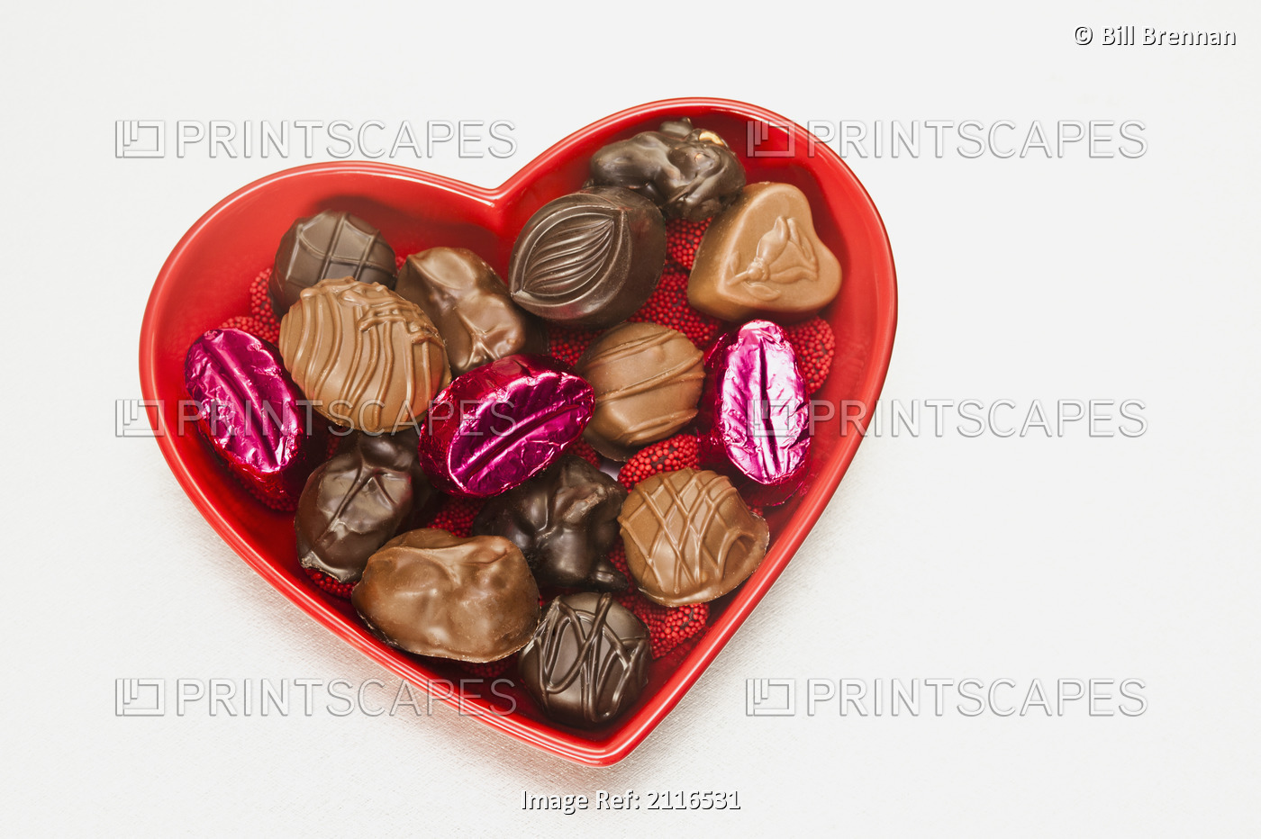 Valentines heart-shaped tray with assortment of sweets.