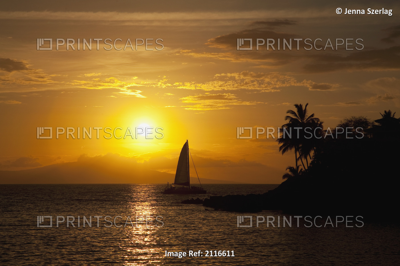 Hawaii, Maui, Makena, A silhouette of a sailboat at sunset.