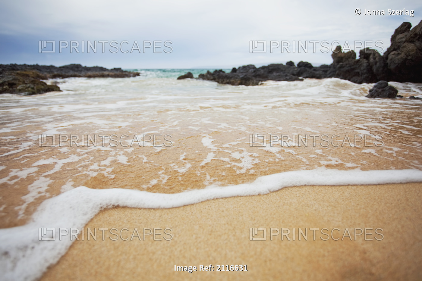 Hawaii, Maui, Makena, A closeup of the ocean over sand.