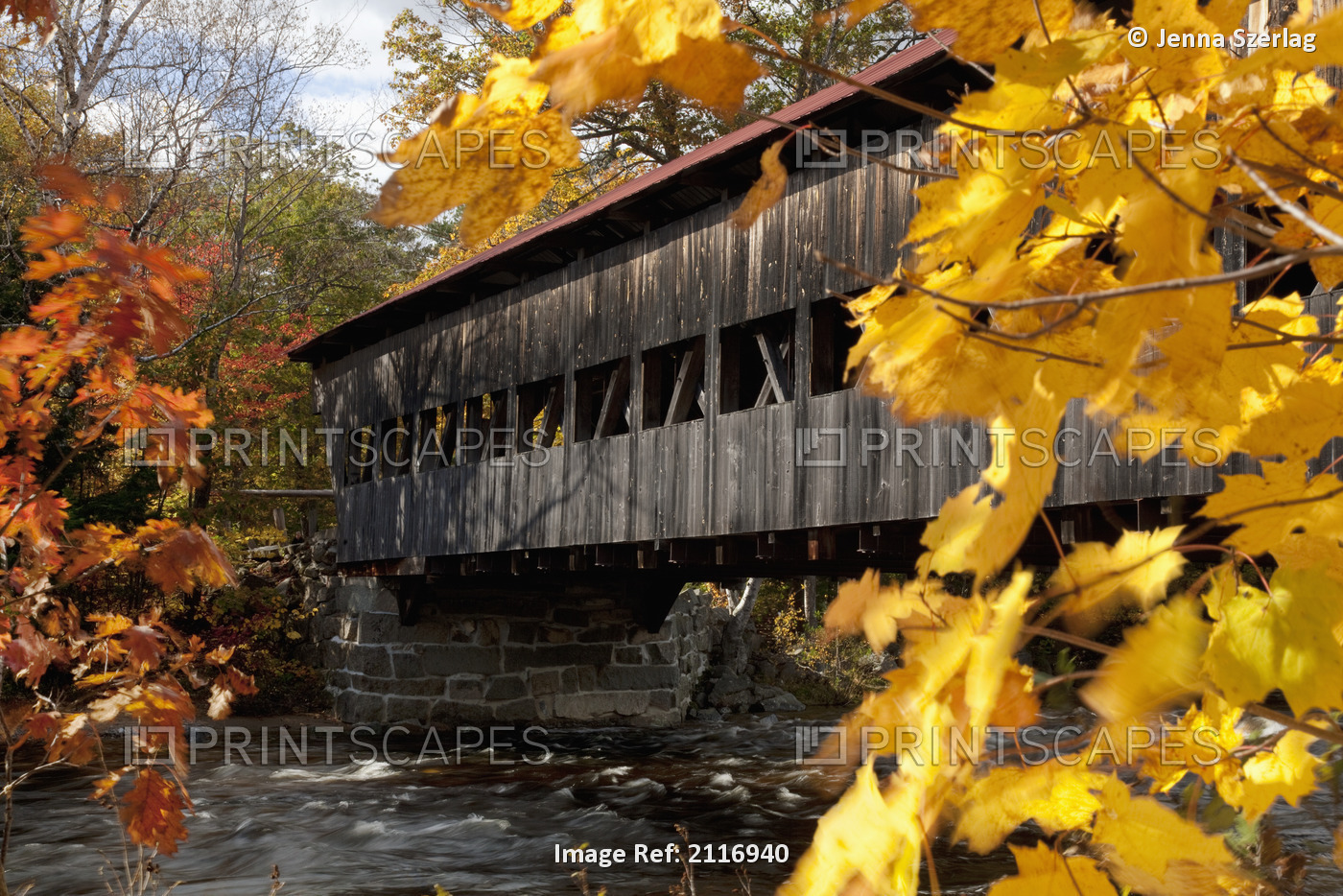 New England, New Hapshire, White mountains, A covered bridge over a river in ...