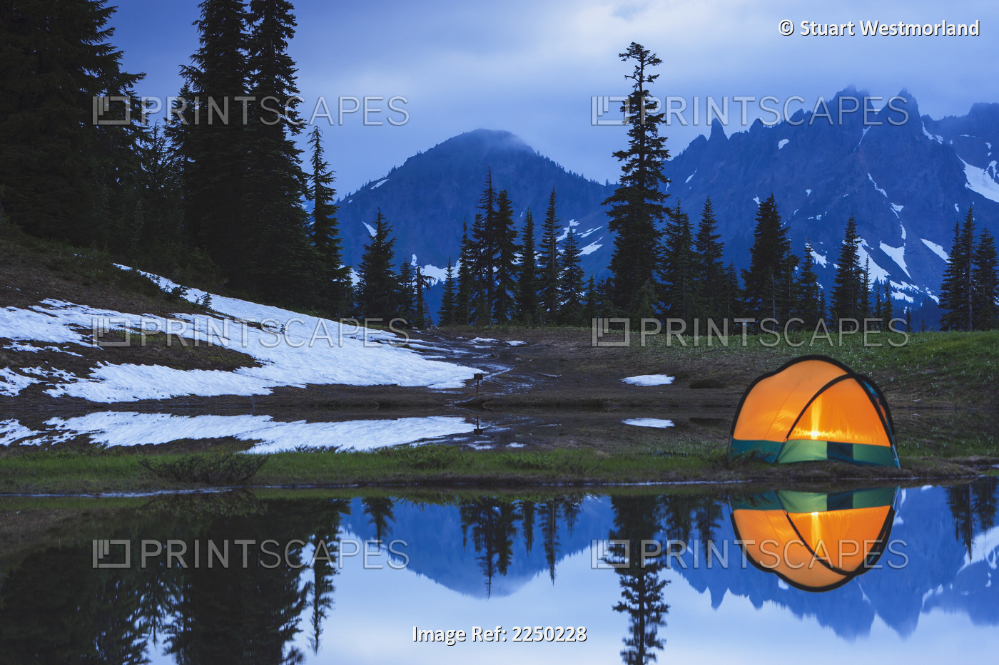Camping tent at sunset by a small reflecting pond near tipsoo lake mount rainer ...