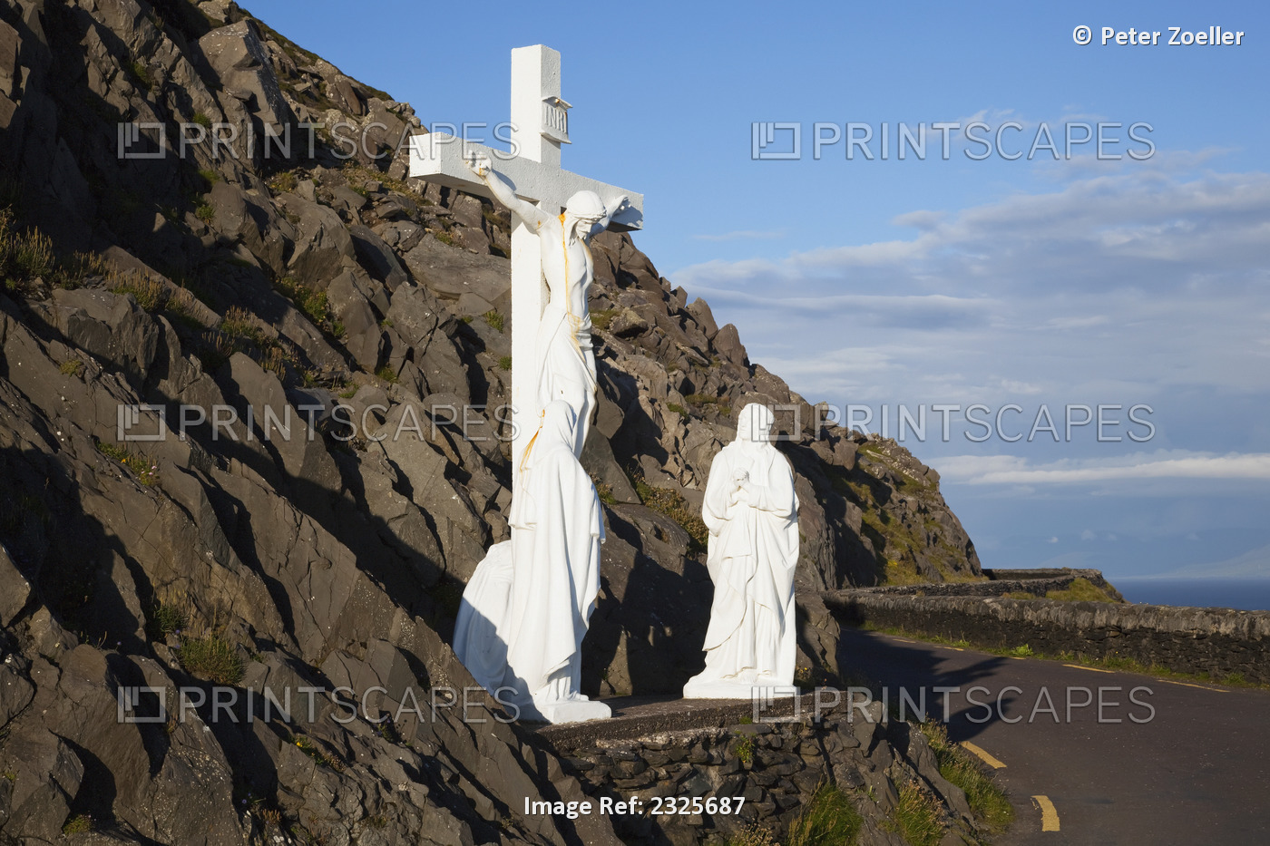 Statue of jesus christ on the cross with two women at the foot of the cross on ...