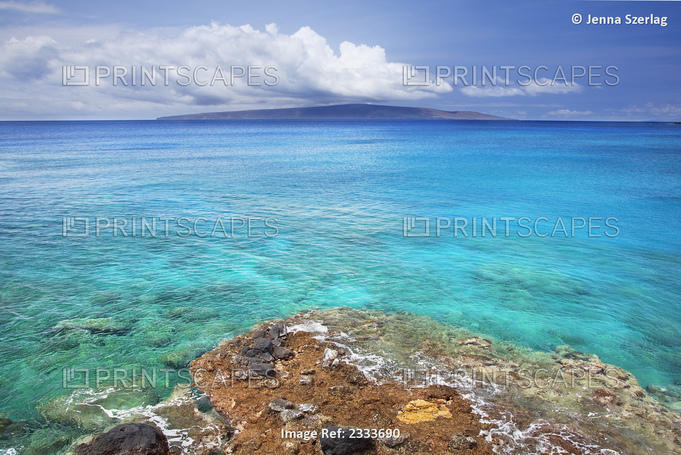 A view of la perouse bay with clear water and coral with kooholawae in the ...