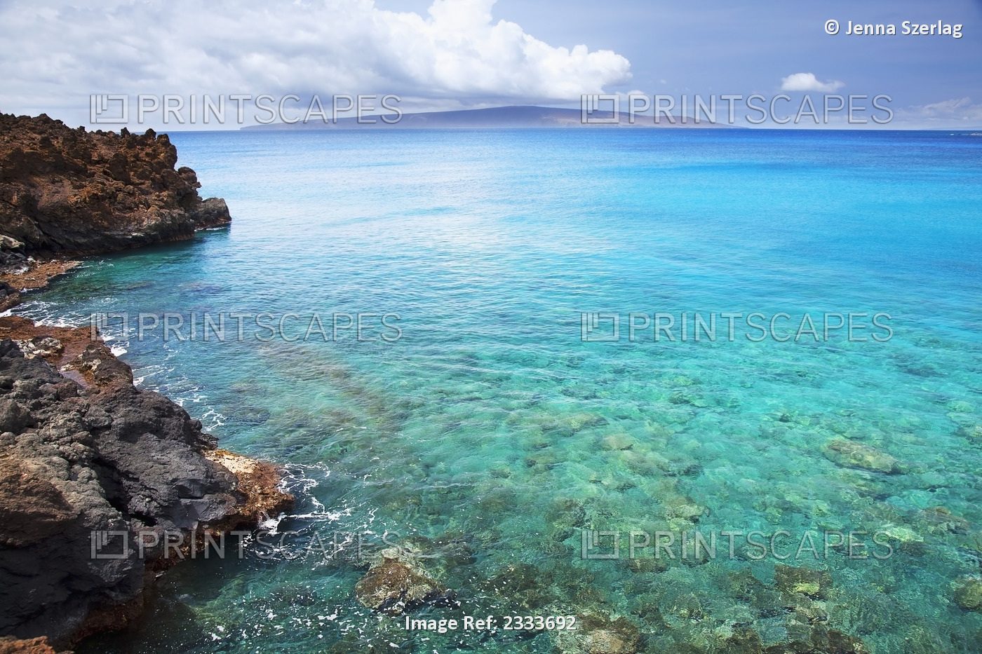 A view of la perouse bay with clear water and coral with kooholawae in the ...