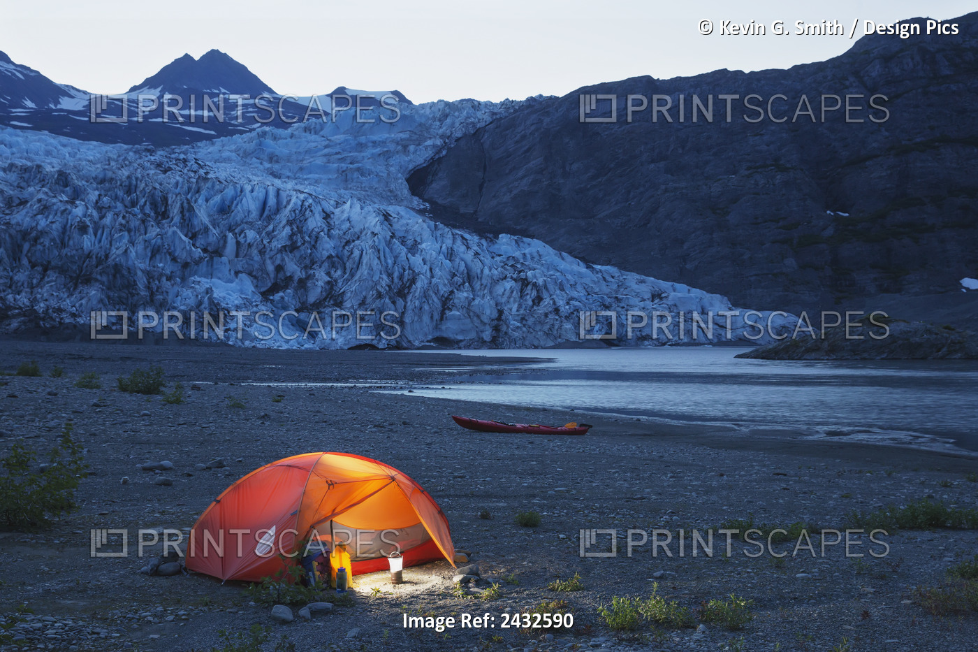 Glowing Tent And Kayak On The Beach In Front Of Shoup Glacier And Mountains At ...