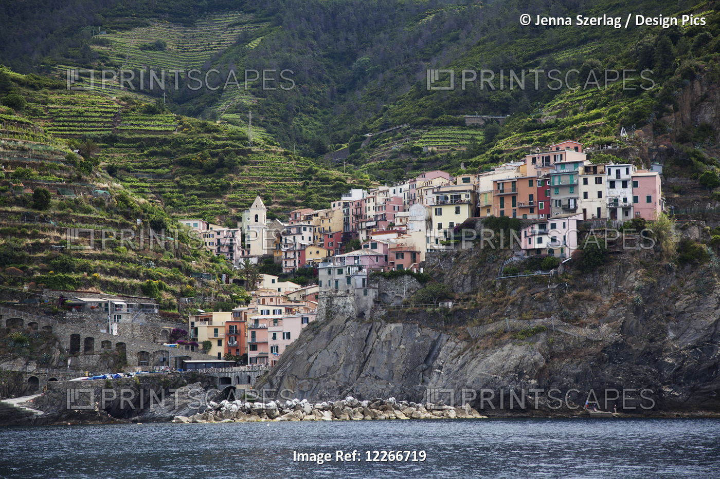 Colourful Houses On The Rugged Coast; Riomaggiore, Liguria, Italy