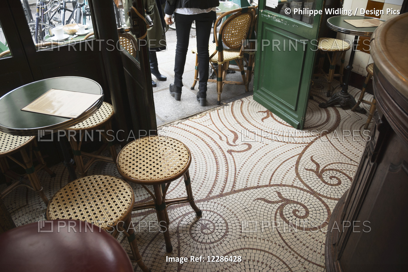 Looking Down At The Floor Of A Parisian Cafe With Small Square Tiles, ...