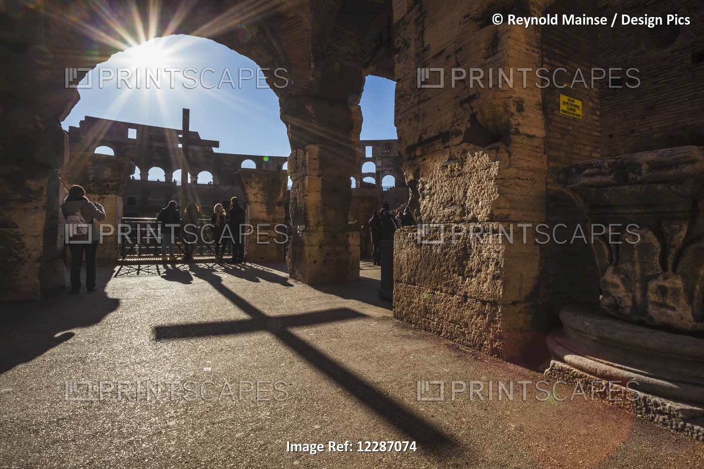 Sunburst Through An Archway At The Colosseum And A Shadow Of A Cross; Rome, ...