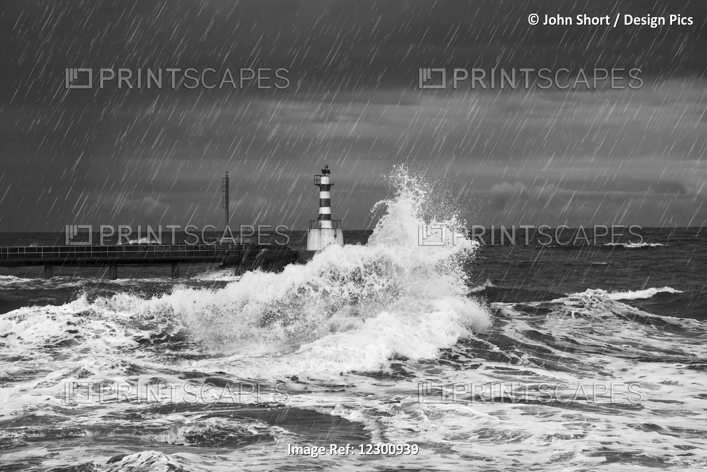Rainfall And Splashing Waves With A Lighthouse Along The Coast; Amble, ...