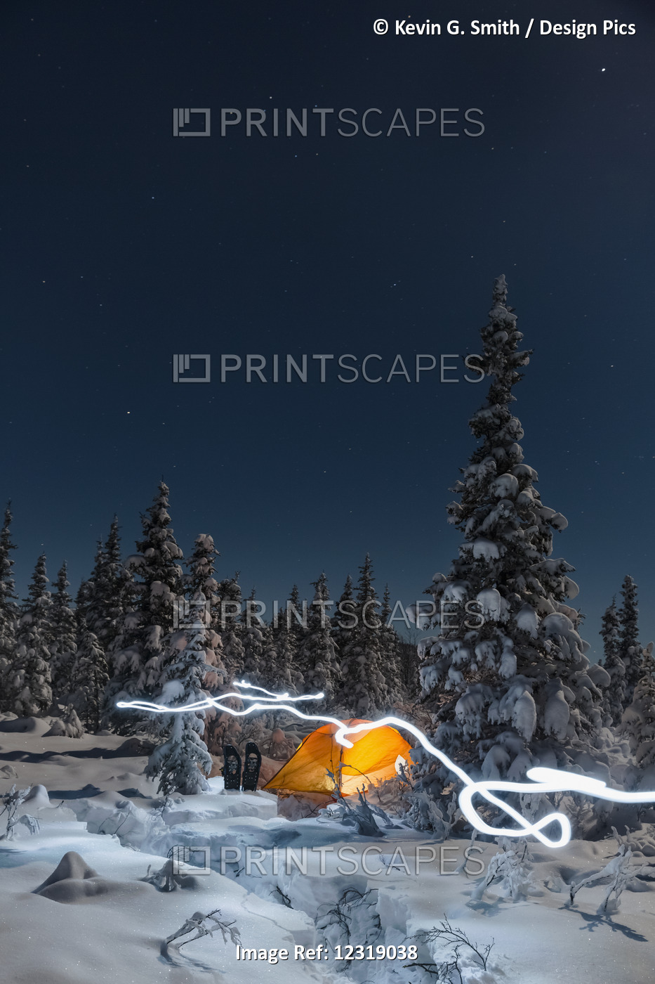 A Trail Of Light Leads Past An Orange Tent In The Middle Of An Snowy Evergreen ...