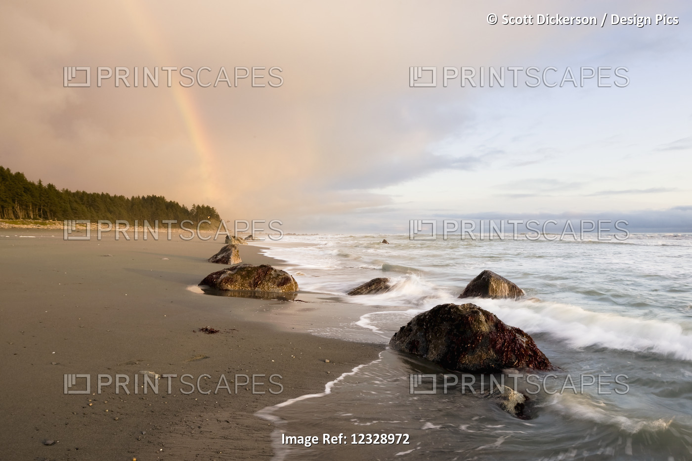 A Rainbow Glows In Storm Clouds Over A Beach And Coastline; Alaska, United ...