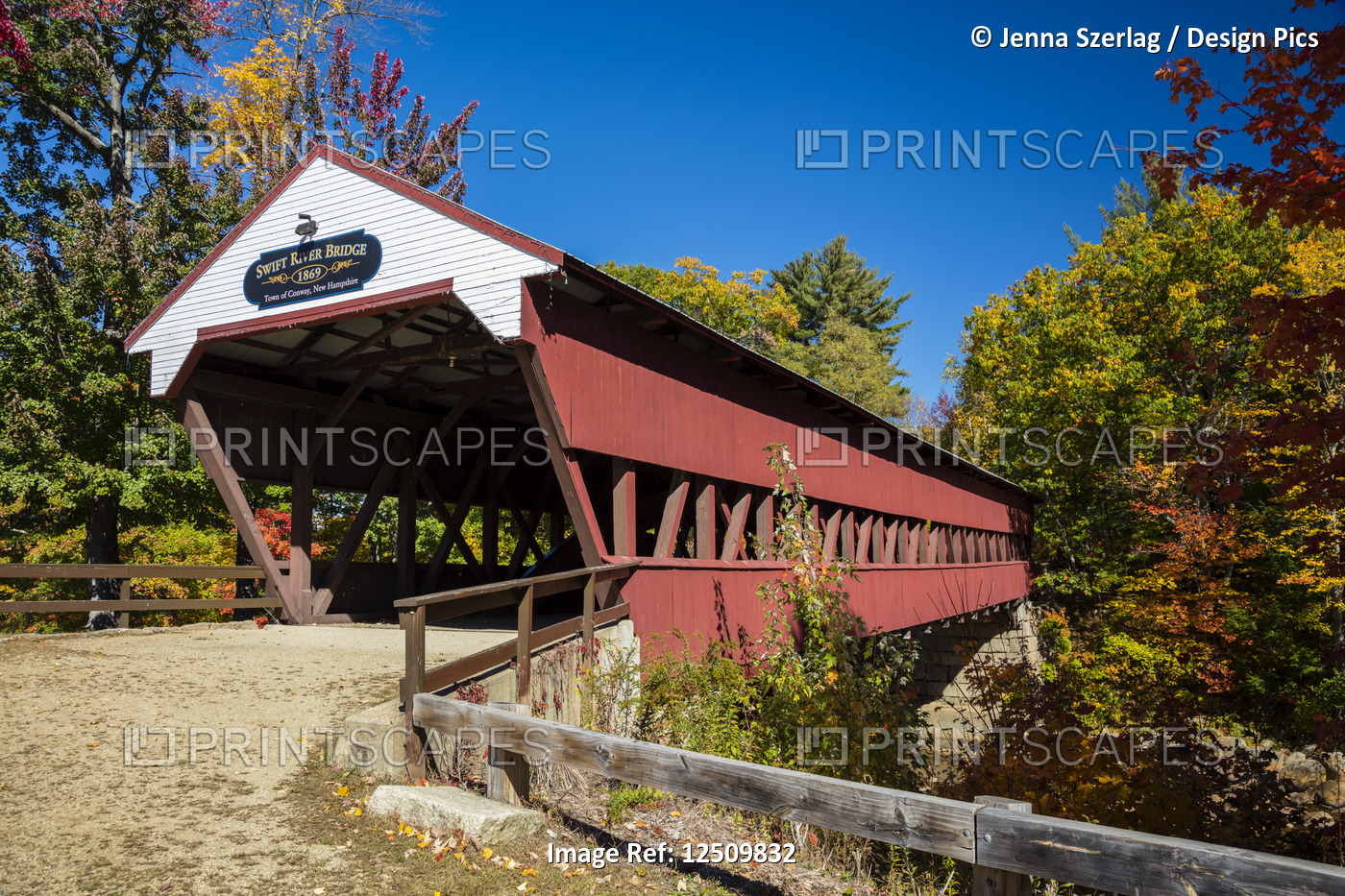 Swift River covered bridge on a back country road in autumn, White Mountains ...
