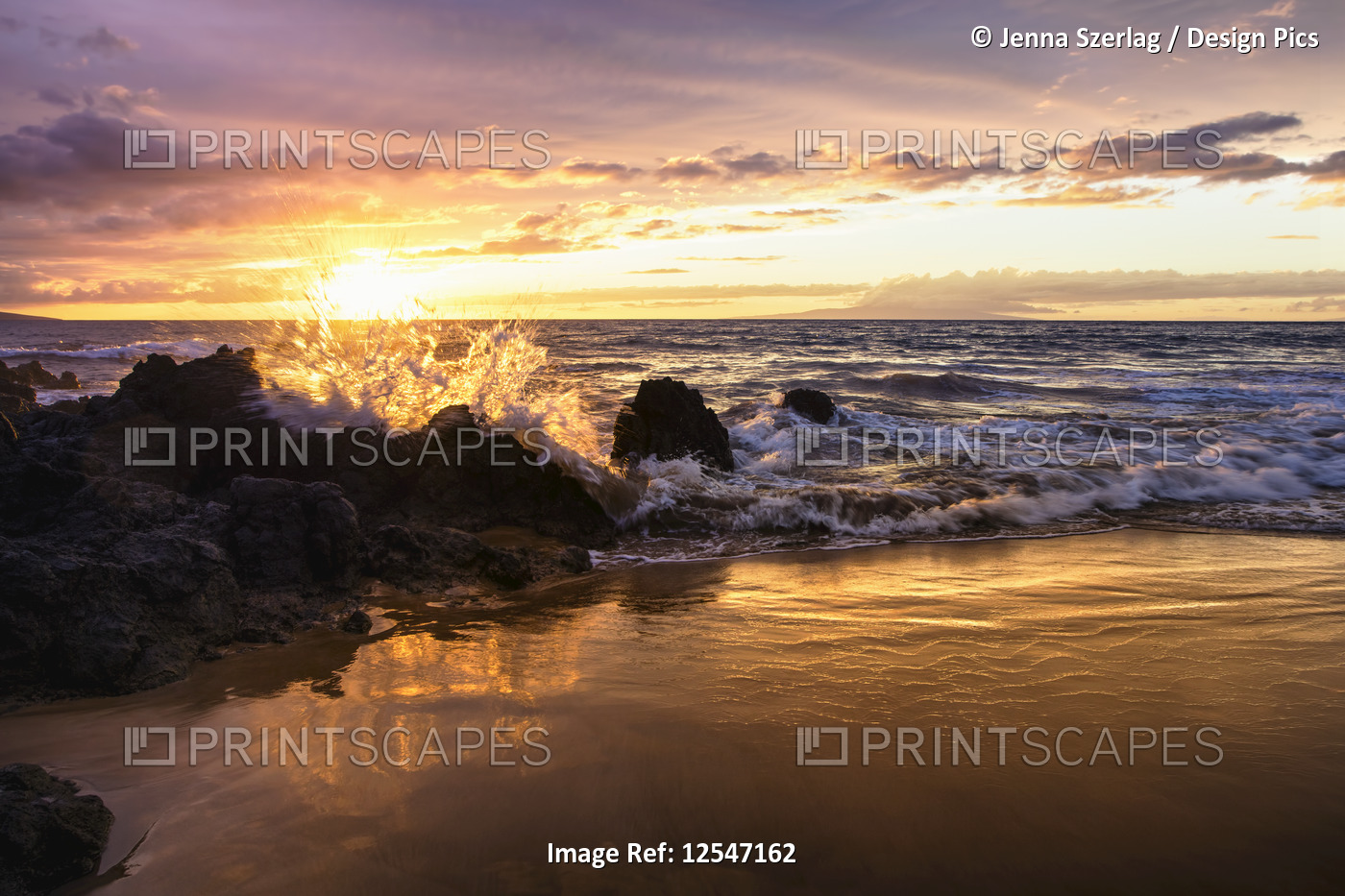 The sun sets with ocean splash, Makena, Maui, Hawaii USA