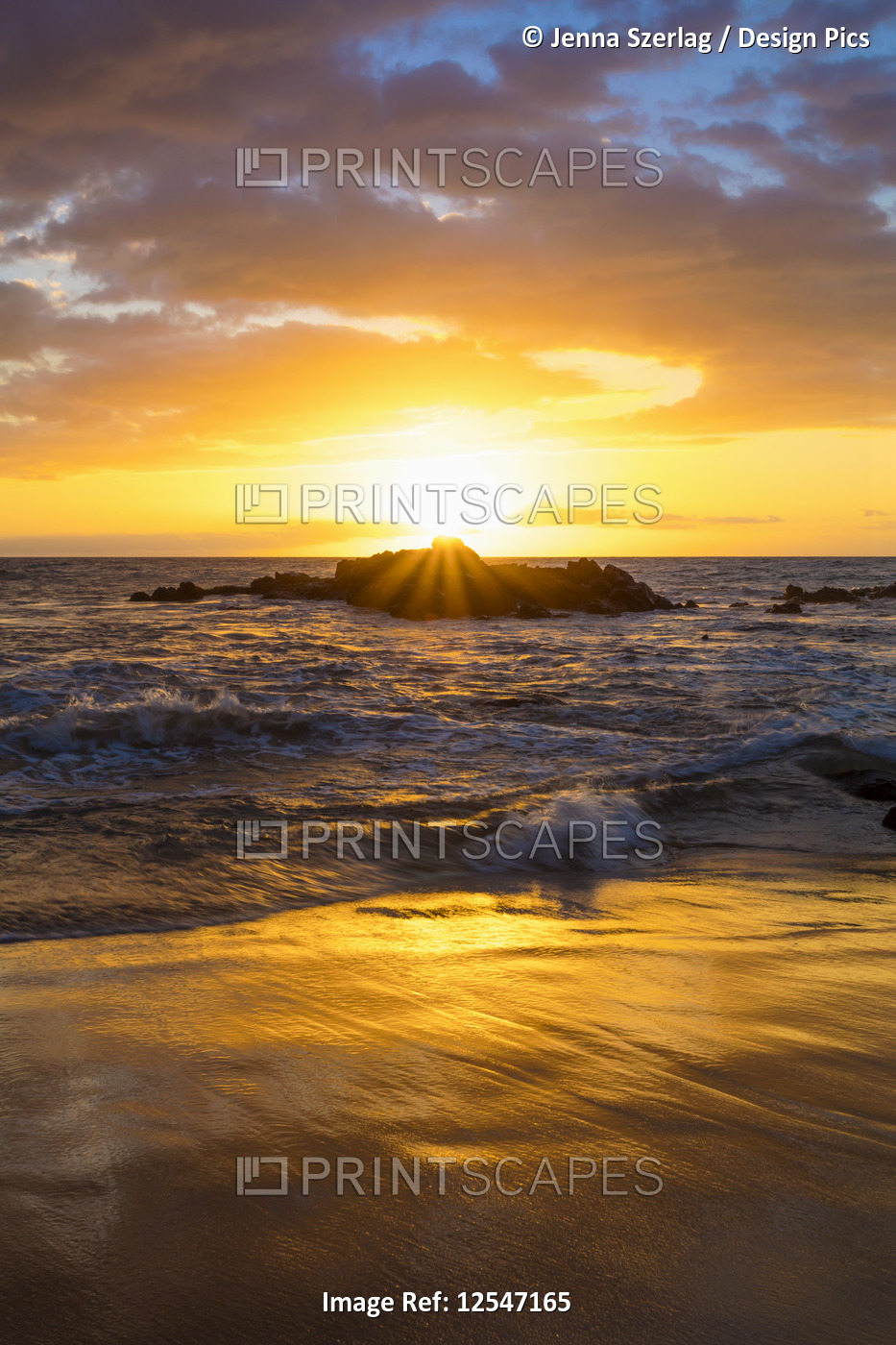 A Golden Sunset with Reflection On Sand at Ulua Beach, Wailea, Maui, Hawaii USA 