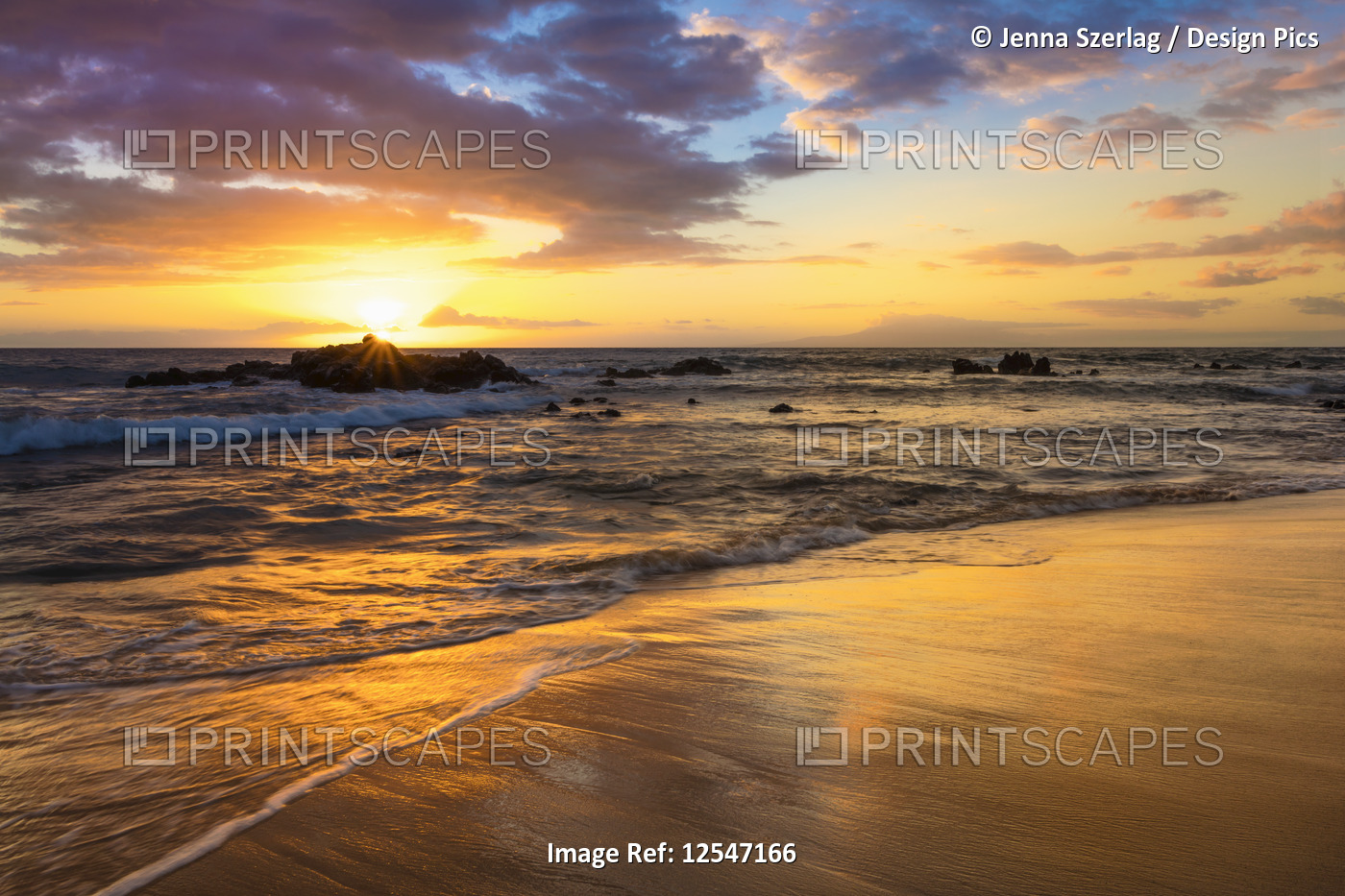 A Golden Sunset with Reflection On Sand at Ulua Beach, Wailea, Maui, Hawaii USA