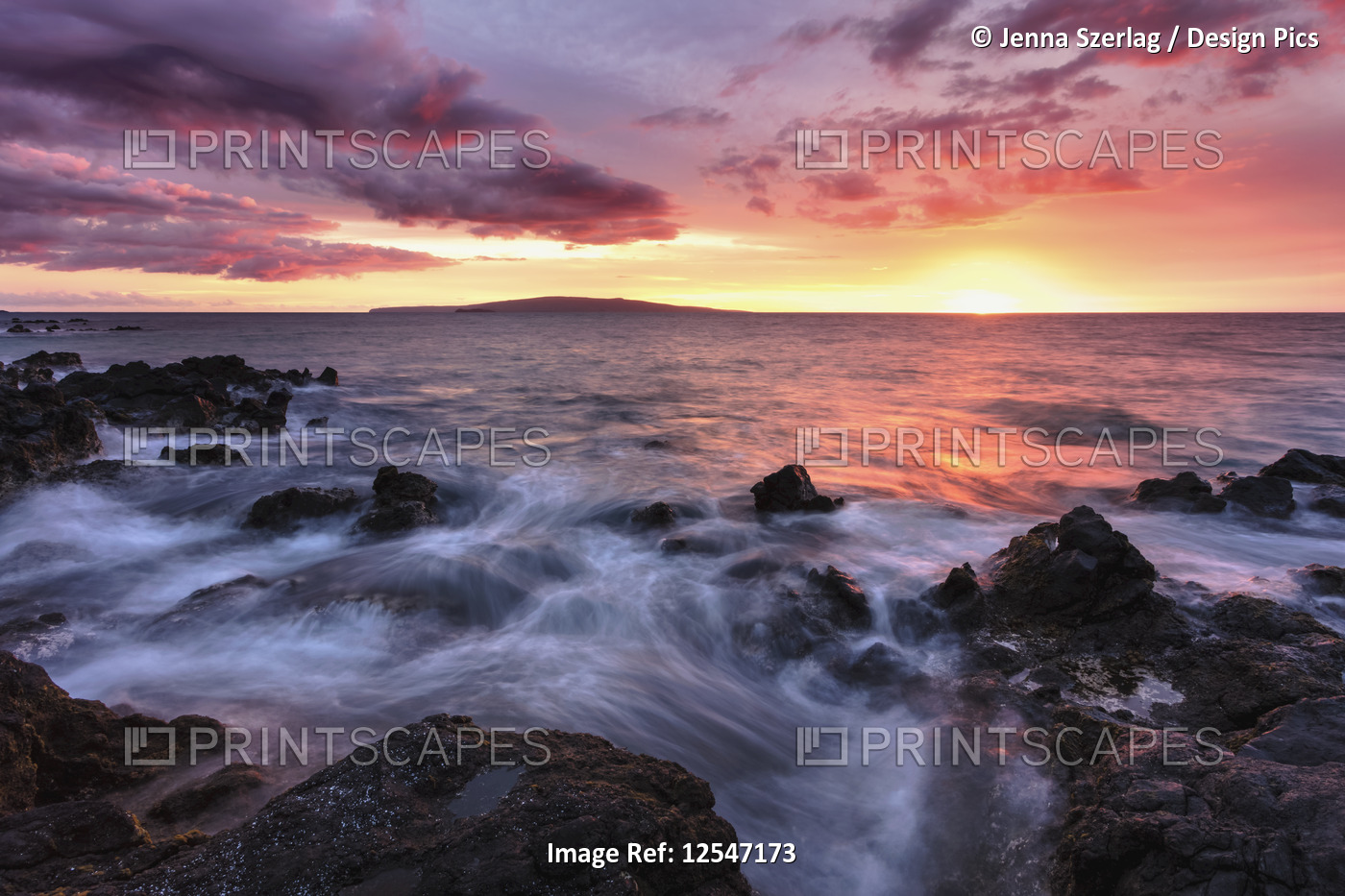 Soft Water Over Lava Rocks With A Red Sunset In Wailea, Maui, Hawaii USA